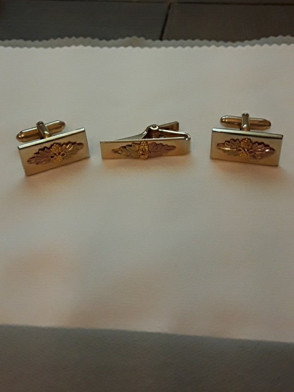 Three piece Cuff links/tie clip gold tone with 10k grape leaf accents